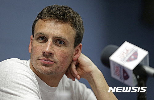 FILE - In this May 12, 2016, file photo, Ryan Lochte listens to a question from the media in Charlotte, N.C. Missy Franklin and Ryan Lochte will be busy in the pool at the Rio Olympics. Just not as busy as they wanted to be. The two popular stars from the U.S. swimming team four years ago in London have just three individual events between them in Rio, hardly the frenetic schedule they've grown accustomed to over the years. (AP Photo/Chuck Burton, File)