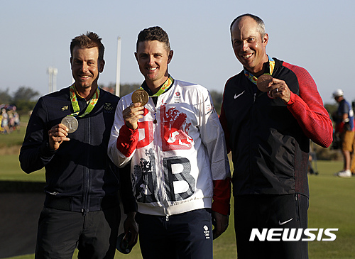 The medalists are seen from left to right, silver medalist Henrik Stenson of Sweden, gold medalist Justin Rose of Great Britain, and bronze medalist Matt Kuchar of the, United States, after the final round of the men's golf event at the 2016 Summer Olympics in Rio de Janeiro, Brazil, Sunday, Aug. 14, 2016. (AP Photo/Chris Carlson)