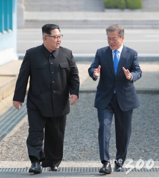 President Moon Jae-in and Chairman of the State Affairs Commission Kim Jong Un walk down together from the Military Demarcation.