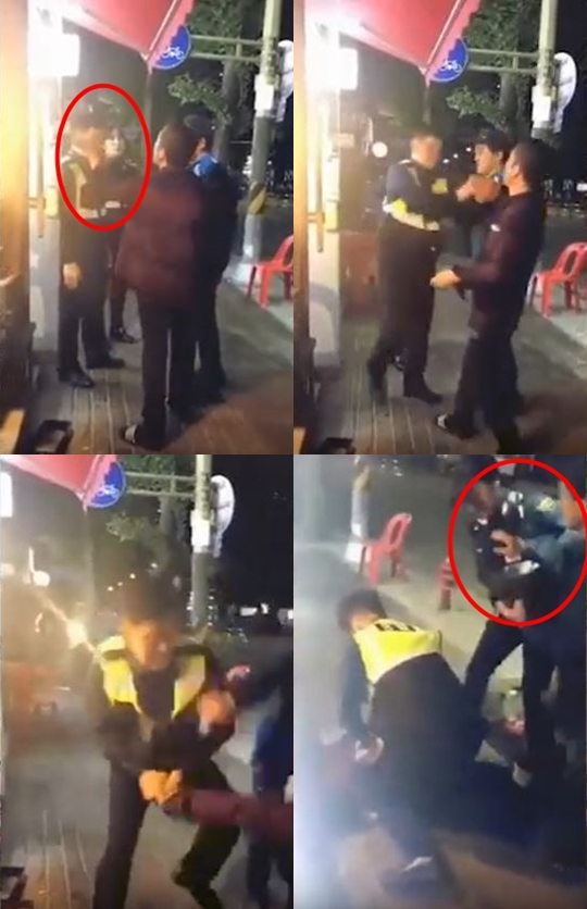 지난 15일 한 온라인 커뮤니티에 올라온 영상.경찰 2명이 술에 취한 남성 2명을 제압하고 있다./사진=온라인 커뮤니티 캡처