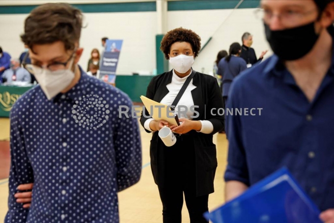 Britni Mann waits to speak with potential employers during a job fair at Hembree Park in Roswell, Georgia, U.S. May 13, 2021. REUTERS/Chris Aluka Berry