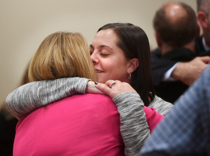 Plaintiffs Nicole Hockley and Erica Lafferty hug following the jury verdict and reading of monetary damages in the Alex Jones defamation trial at Superior Court in Waterbury, Connecticut, U.S., on October 12, 2022. Brian A. Pounds /==1
