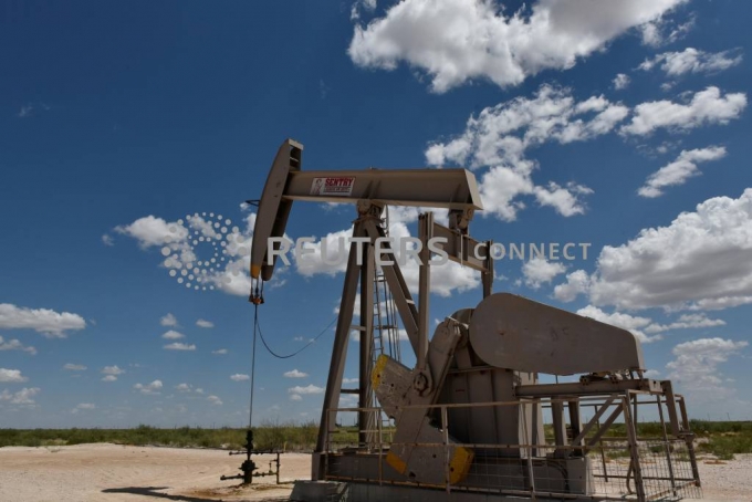 A pump jack operates in the Permian Basin oil production area near Wink, Texas U.S. August 22, 2018. Picture taken August 22, 2018. REUTERS/Nick Oxford/File Photo/==1